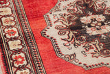 Vintage Turkish Oushak rug detail: soft texture, madder root red field, charcoal bronze patterns.