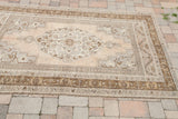 Vintage Oushak carpet with classic faded silver grey, beige, and bronze pattern.