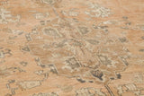 Sun-faded terra cotta hand-knotted Oushak carpet with blanched charcoal and ivory pattern.
