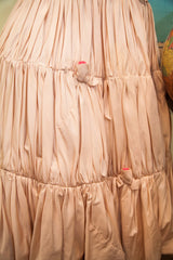 Blush pink taffeta dress skirt with gathered tiers and hot pink rosebud accents.