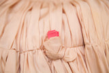 Blush pink taffeta rosebud detail with bright hot pink ribbed center.