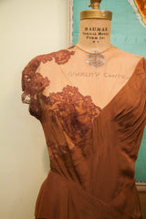 Intricate lace and sheer neckline of the vintage Dorothy O'Hara brown evening gown.