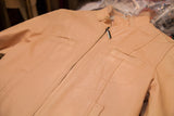 Light pink vintage leather jacket with front pocket, prominent stitching, and zipper.