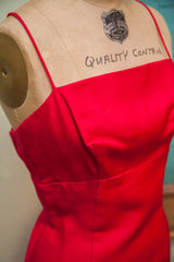 Close-up of the vintage dress bodice, showing its straight neckline and thin straps.