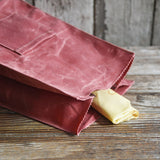Radish dusty pink waxed canvas Marlowe Lunch Bag, showing pocket and open top.