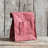 Peg and Awl Marlowe lunch bag, dusty pink waxed canvas with pocket and leather tag.