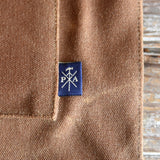 Peg and Awl Marlowe Lunch Bag spice brown waxed canvas and logo tag.
