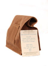 Marlowe Lunch Bag Spice with rolled top, side pocket, and brand tag.