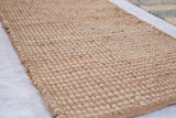Dense, handwoven texture of a natural undyed Martine Collection jute rug.