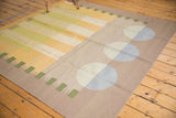 Contemporary Kilim with abstract beige, pale gold, and powder blue circular motifs.