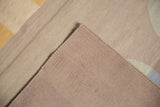 Folded corner of a contemporary Kilim rug, showing its handwoven reverse and secured selvage.