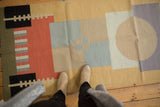 Geometric stacked design of a modern abstract Kilim runner, with cinnabar red, black, and sand.
