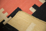 Handwoven contemporary Kilim runner's tight side cord selvedge and geometric coral, black, sand design.