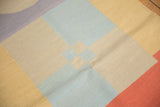 Modern abstract geometric stacked design in sand, pale blue, and lilac Kilim weave.