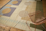Abstract contemporary Kilim rug section with beige, pale violet geometric blocks and zipper pattern.