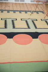 Abstract geometric kilim pattern with cinnabar red circles, pale silver blue shapes, and black bands.