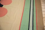 Abstract design on vintage Contemporary Kilim rug with cinnabar circle and emerald green stripes.