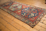 Angled perspective of a late 19th-century Kazak runner with a bold double medallion design.