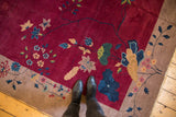 Antique Chinese Nichols Art Deco carpet with sprawling wine red field and delicate blossoms.