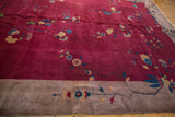 Antique Chinese Art Deco carpet corner: wine red field, sprawling blossoms, beige border.