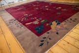 Antique Art Deco carpet's sand beige border with sprawling blossoms and intact selvage.