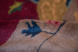 Antique Nichols Art Deco carpet pile: cranberry red, dusty gold, cobalt blue blossoms.