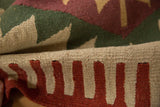 Hand woven beige and red flatweave texture with secured side cord on Turkish Kilim.
