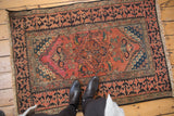 Antique Fereghan rug corner detail, Lotto border, wear to brick red field.