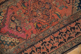Antique Fereghan rug detail: brick red field with birds, visible wear, and bold Lotto Turkish border.