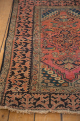 Antique Fereghan rug's wide Lotto Turkish border with brick red, charcoal, and aged pile.