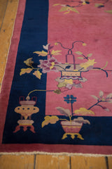 Art Deco runner's cobalt blue border with a vase motif, raspberry pink field, and beige fringe.