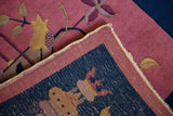 Detail of Art Deco rug corner with faded pink pile, yellow vase motif, and blue foundation.