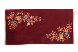 Vintage Nichols Art Deco rug runner with asymmetrical floral sprays over a rich burgundy field.