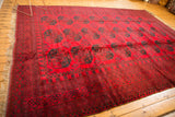 Cherry red Ersari carpet with dark teal elephant foot gul motifs, thick pile.