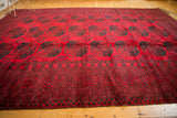 Thick pile geometric border of a vintage Ersari rug in cherry red and dark dusty teal.