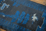 Hand-knotted pictorial deer, bird, and blue tree motifs on charcoal Peking runner.