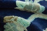 Even, hand-knotted pile texture of a vintage Peking rug in indigo blue and beige.