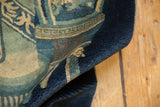 Dense indigo blue pile and original side selvage of this Antique Chinese Peking rug.
