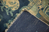 Durable hand-knotted indigo blue foundation and white cotton fringe of the antique Peking rug.
