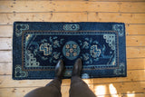 Indigo, powder blue geometric border and lightning spandrel on antique Peking rug runner.