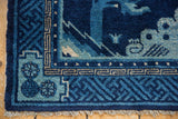Hand-knotted fringe and blue, ivory geometric key fret border of the antique Peking rug.