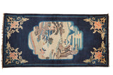 Antique Peking rug runner with a pictorial medallion, chrysanthemum corners, and a deep indigo blue ground.