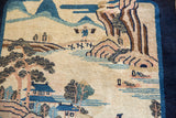 Finely knotted villager figure within the pictorial mountain landscape of a collector Peking rug.