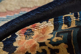Plush, even hand-knotted pile of an antique Peking rug in indigo, sand, and dusty rose.