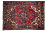 Vintage Heriz carpet, large center medallion, geometric floral design in red, navy, ivory.