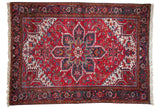 Vintage Mehrivan carpet with a classic Heriz-style geometric medallion in cherry red, navy blue, and ivory.