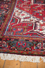 Plush, full pile and clean ivory fringe on the corner of a vintage Persian Mehrivan carpet.