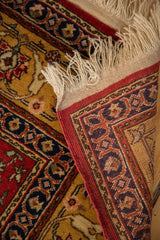 Woven back, intact side cord, and ivory fringe of a vintage Romanian Hereke design rug.