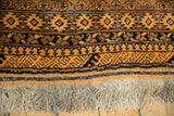Thick wool pile, saffron and navy geometric borders, and original hand-knotted fringe.