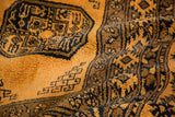Thick, full wool pile of a vintage Daulatabad carpet showing saffron yellow and dark navy details.